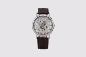 Detailed macro view of the skeleton dial and brown leather strap on this men's quartz watch