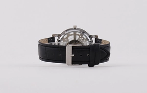 Detailed back view of skeleton quartz watch with black leather strap buckle.