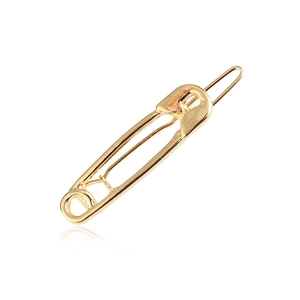 Minimalist golden metal safety pin hair clip for women on white background with reflections
