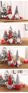 Detail views of red and grey Christmas faceless gnomes on cozy wooden tabletop