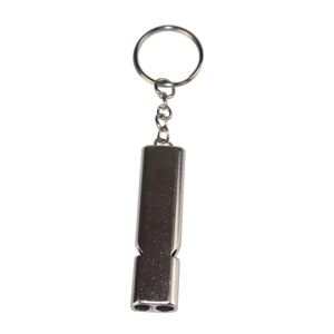 Macro detail of silver aluminum survival whistle with double tubes and key ring attachment