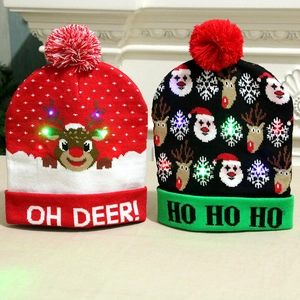 LED knitted Christmas hats featuring reindeer and Santa Claus motifs with pom-poms