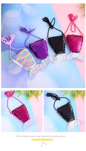 Detail view of colorful sequin mermaid tail coin purses with holographic finish and drawstrings