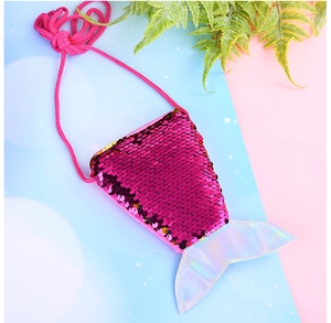 Detail of pink mermaid tail crossbody bag featuring reversible sequins and magic fabric