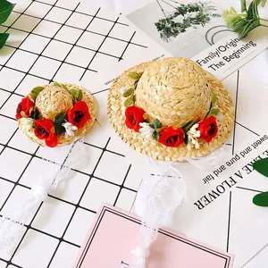 Handmade pet straw hats with red roses and white lace straps for cats and small dogs