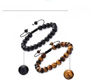 Detail view of 8mm natural red tiger eye and black matte stone beaded bracelet set