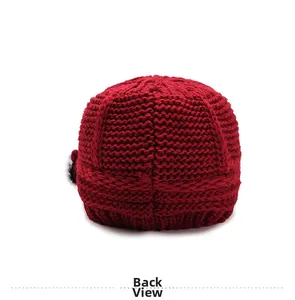 Macro shot showing the back view of the thick red knitted wool hat with soft texture