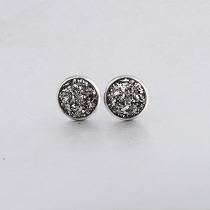 Close-up of 10mm silver stainless steel stud earrings with dark grey drusy crystals
