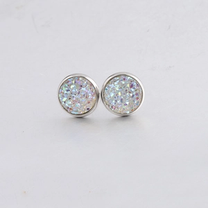 Detailed close-up of 10mm round silver stud earrings with glittering colorful drusy stone