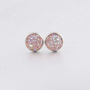 Detailed macro view of 10mm round pink drusy stud earrings in silver stainless steel setting