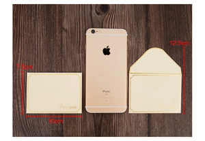 Detail view of beige gold-foil greeting card and envelope set with dimension labels