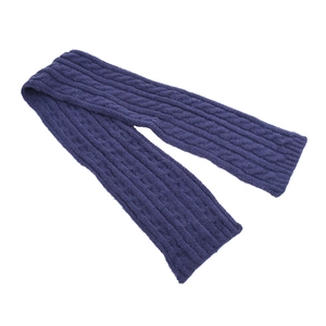 Detail shot of navy blue cable-knit texture on a cozy winter scarf for children