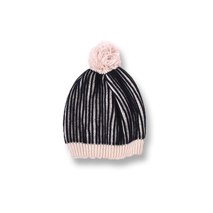 Detail of the pink and black striped knit texture and pom-pom of this kids' winter hat