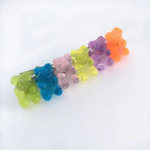 Detail of candy-colored gummy bear hair clips with translucent resin on metal base