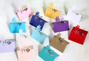 Laser cut Mr & Mrs wedding place cards with heart ring design in various colors