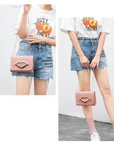Detail of pink crossbody bag featuring a golden lip-shaped clasp and delicate chain strap