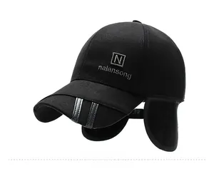 Detailed side view of black wool baseball cap with ear protection and embroidered logo
