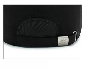 Detail of adjustable metal buckle and black wool fabric on men's winter baseball cap
