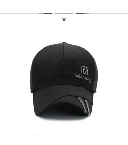 Front view of black wool baseball cap with embroidered logo and three grey brim stripes