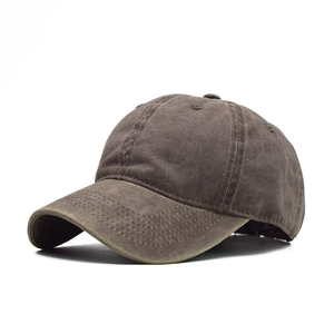 Detailed stitching and breathable eyelets on dark brown washed cotton baseball cap