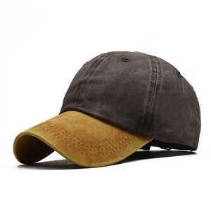 Macro shot of two-tone washed cotton baseball cap with gray crown and yellow curved brim