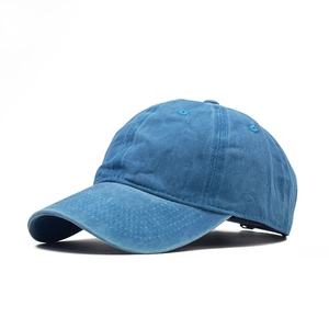 Detail of navy washed denim baseball cap showing fabric texture and adjustable strap