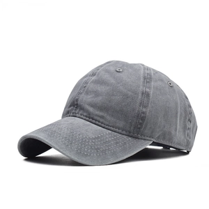 Detail view of washed grey cotton baseball cap with six-panel design and premium texture