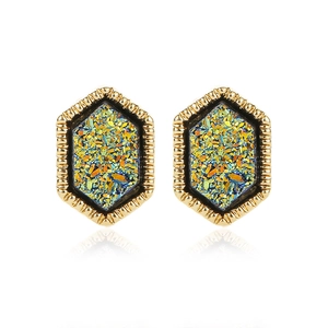 Detailed macro view of golden hexagonal studs with shimmering colorful crystals