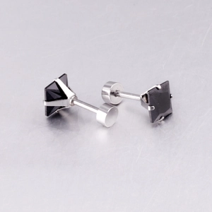 Detail view of square black cubic zirconia studs with four-claw stainless steel setting