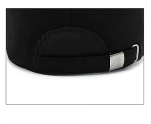 Detail of adjustable metal buckle with M logo on black wool baseball cap for men
