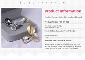 Detail view of matte leaf brooch with pearls and rhinestones measuring 46mm by 32mm