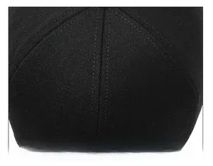 Macro shot of precise double-stitched crown seams on a black wool winter baseball cap