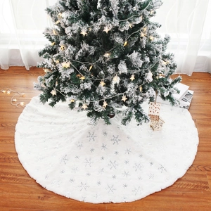 White plush Christmas tree skirt with silver snowflake embroidery for festive home decor