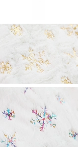 Detail of white faux fur Christmas tree skirt featuring sparkling sequined snowflake patterns