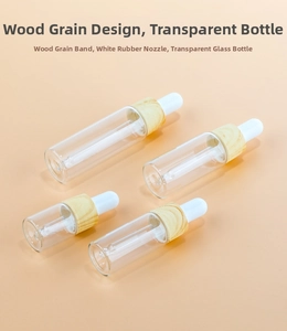 Detailed macro view of clear glass dropper bottles with elegant wood grain caps