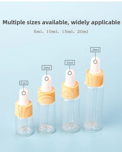Detail view of wood grain glass dropper bottles in 5ml to 20ml sizes for essential oils