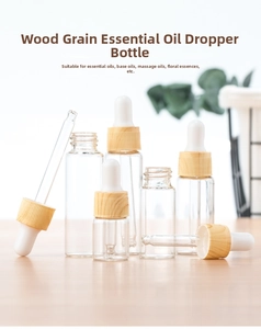 Close-up of glass dropper bottles with light wood grain caps on a wooden surface