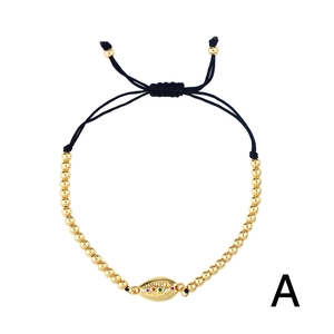 Bohemian adjustable black braided shell bracelet with gold beads and colorful zircons