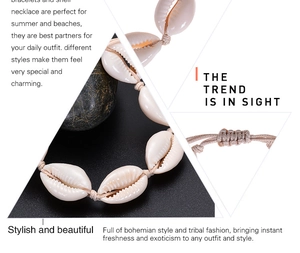 Detailed close-up of handmade natural cowrie shell necklaces and woven bracelets