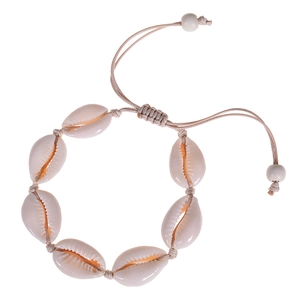 Detail of natural seashell bracelet with hand-woven adjustable cord for beach style