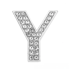 Macro shot of silver letter Y slide charm with sparkling pavé crystals for DIY bracelets