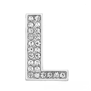 Macro shot of chrome-finished letter L charm with pavé clear rhinestones for DIY bracelets