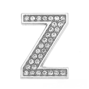 Macro shot of silver letter Z charm featuring sparkling rhinestones for DIY bracelets