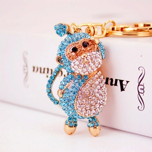 Cute crystal rhinestone monkey keychain charm with sky blue and white stones on gold metal