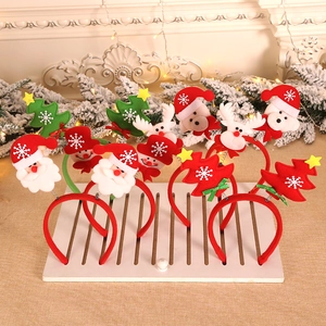 Christmas party headband set with Santa, reindeer, and tree designs on a festive mantle