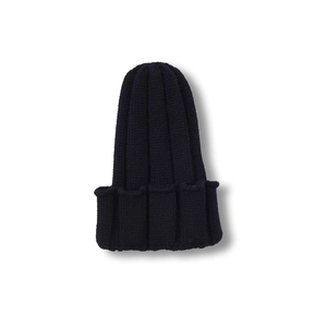 Detail view of navy blue knit beanie showing thick vertical ribbed texture and wide cuff