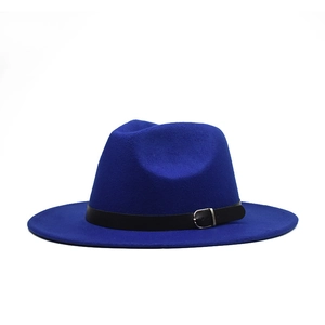 Detail of royal blue wool fedora hat featuring a black leather band and silver buckle