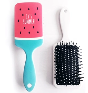 Detail view of pink and green watermelon pattern hairbrush with It's Summer text