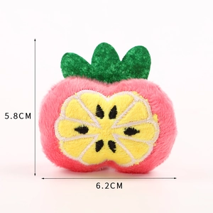 Detailed view of pink plush strawberry accessory with dimensions 5.8cm by 6.2cm