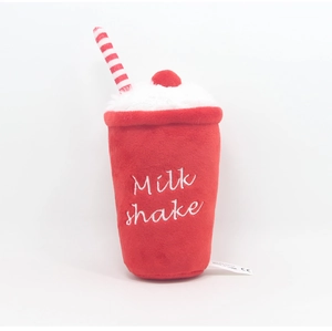 Detail view of red plush milkshake toy with straw, cherry and CE certification label